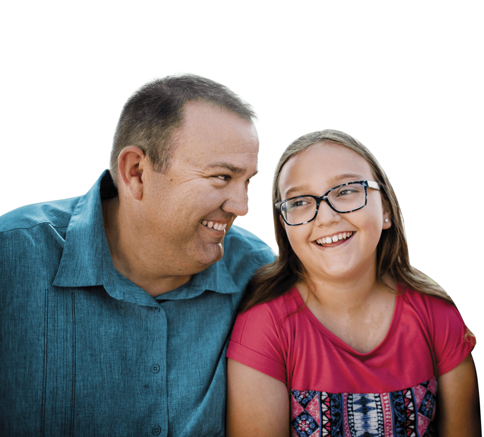 Father and daughter smiling and looking at each other. Actor portrayals.